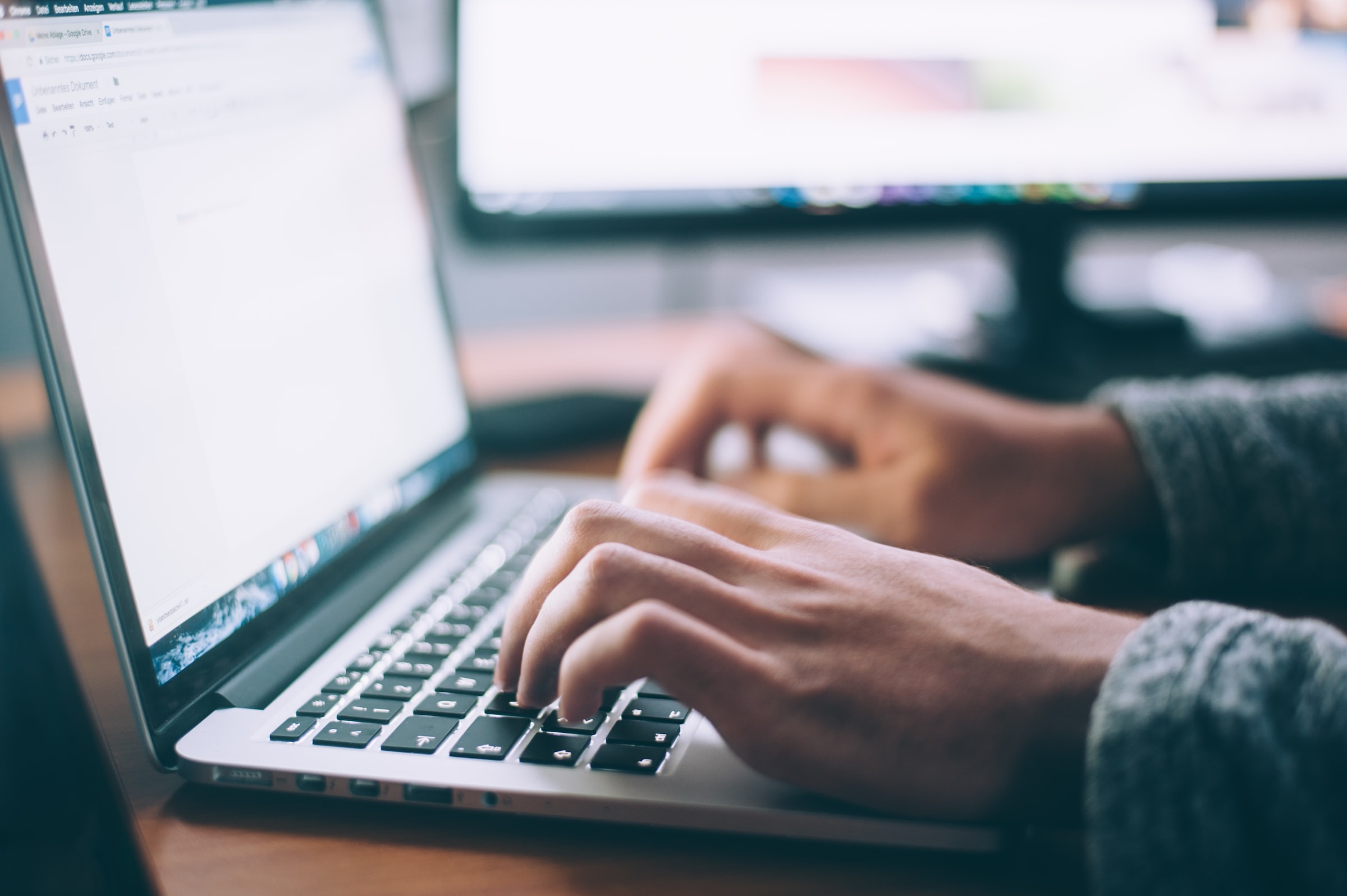 A man writing on his laptop