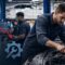 automotive technician working on complex vehicle as dealerships face growing skilled worker shortage